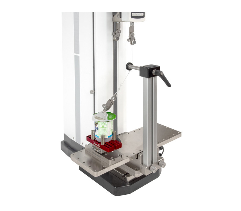 G1109 se muestra en una prueba de pelado con la fijación de ángulo ajustable AC1078 opcional, el agarre de botella G1058 y el adaptador de agarre AC1080. El agarre de componentes en miniatura G1003 fija la lengüeta de la lámina.