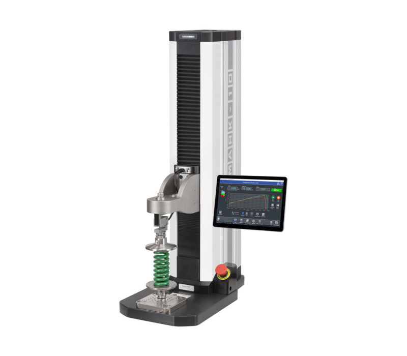 Banco de ensayos de fuerza F755S configurado para ensayos de compresión de muelles con dos platos de compresión de alta capacidad G1087