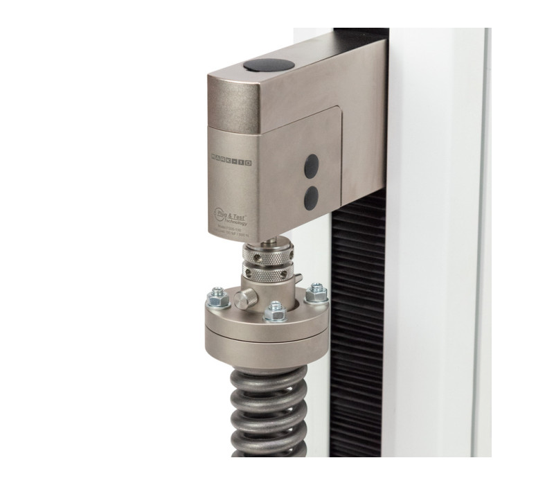 G1123 se muestra en una utilización habitual con muelle de compresión de baja deflexión. Ajuste los cuatro tornillos y las tuercas para garantizar un encaje completo con la parte superior de la muestra.